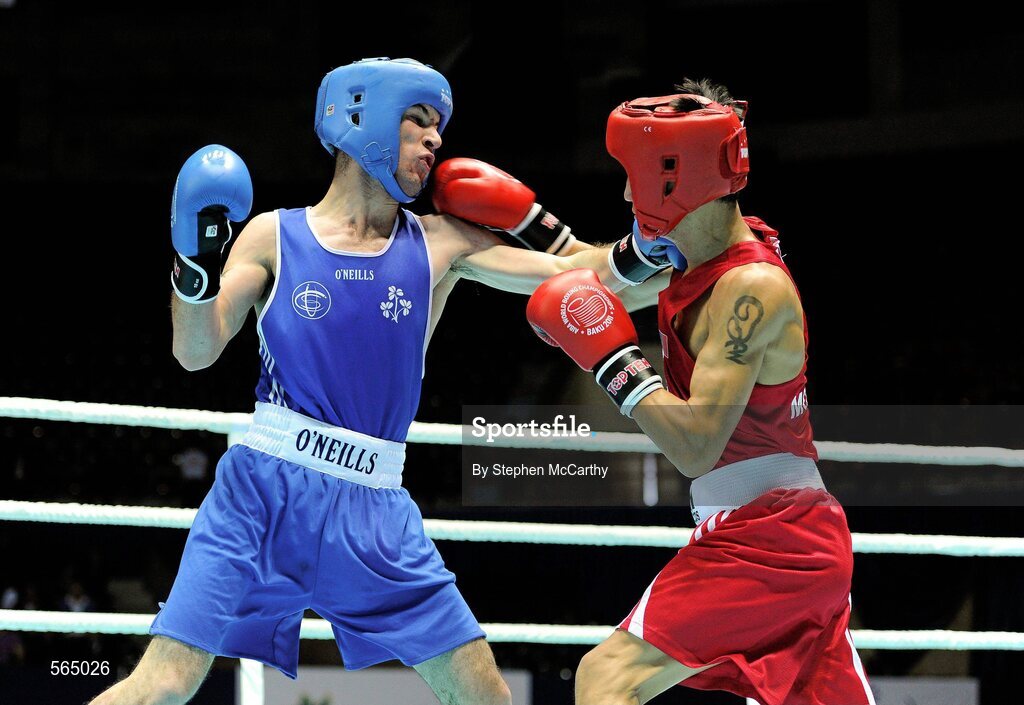 4 October 2011; John Joe Nevin, Cavan B.C., representing Ireland, left, exchanges punches with Otgondalai Dorjnyambuu, Mongolia, during their 56kg bout. Nevin won the contest on countback after the bout ended 18-18. Nevin's victory ensured progression to the Quarter-Finals and also qualification for the London 2012 Olympic Games. 2011 AIBA World Boxing Championships - Last 16, John Joe Nevinl v Otgondalai Dorjnyambuu. Heydar Aliyev Sports and Exhibition Complex, Baku, Azerbaijan. Picture credit: Stephen McCarthy / SPORTSFILE