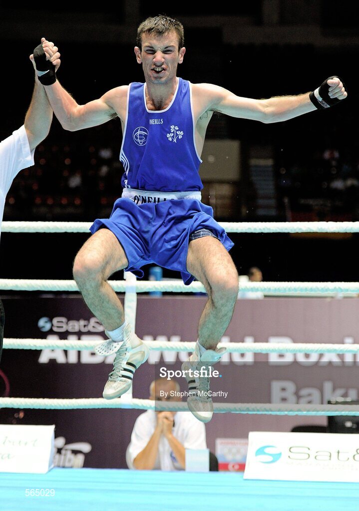 4 October 2011; John Joe Nevin, Cavan B.C., representing Ireland, celebrates victory over Otgondalai Dorjnyambuu, Mongolia, following their 56kg bout. Nevin won the contest on countback after the bout ended 18-18. Nevin's victory ensured progression to the Quarter-Finals and also qualification for the London 2012 Olympic Games. 2011 AIBA World Boxing Championships - Last 16, John Joe Nevin v Otgondalai Dorjnyambuu. Heydar Aliyev Sports and Exhibition Complex, Baku, Azerbaijan. Picture credit: Stephen McCarthy / SPORTSFILE