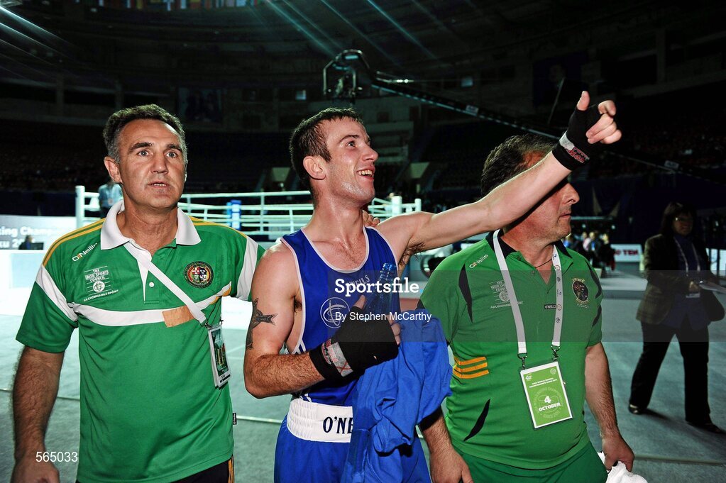4 October 2011; John Joe Nevin, Cavan B.C., representing Ireland, celebrates victory over Otgondalai Dorjnyambuu, Mongolia, following their 56kg bout with coaches Billy Walsh, left, and Zaur Antia. Nevin won the contest on countback after the bout ended 18-18. Nevin's victory ensured progression to the Quarter-Finals and also qualification for the London 2012 Olympic Games. 2011 AIBA World Boxing Championships - Last 16, John Joe Nevin v Otgondalai Dorjnyambuu. Heydar Aliyev Sports and Exhibition Complex, Baku, Azerbaijan. Picture credit: Stephen McCarthy / SPORTSFILE