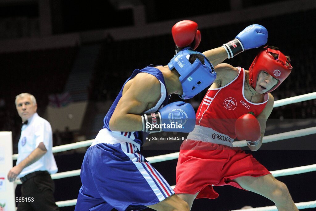 4 October 2011; Michael Conlan, St. John Bosco B.C., Belfast, Antrim, representing Ireland, right, exchanges punches with Nordine Oubaali, France, during their 52kg bout. Conlan won the contest 20-17 and ensured progression to the Quarter-Finals and also qualification for the London 2012 Olympic Games. 2011 AIBA World Boxing Championships - Last 16, Michael Conlan v Nordine Oubaali. Heydar Aliyev Sports and Exhibition Complex, Baku, Azerbaijan. Picture credit: Stephen McCarthy / SPORTSFILE