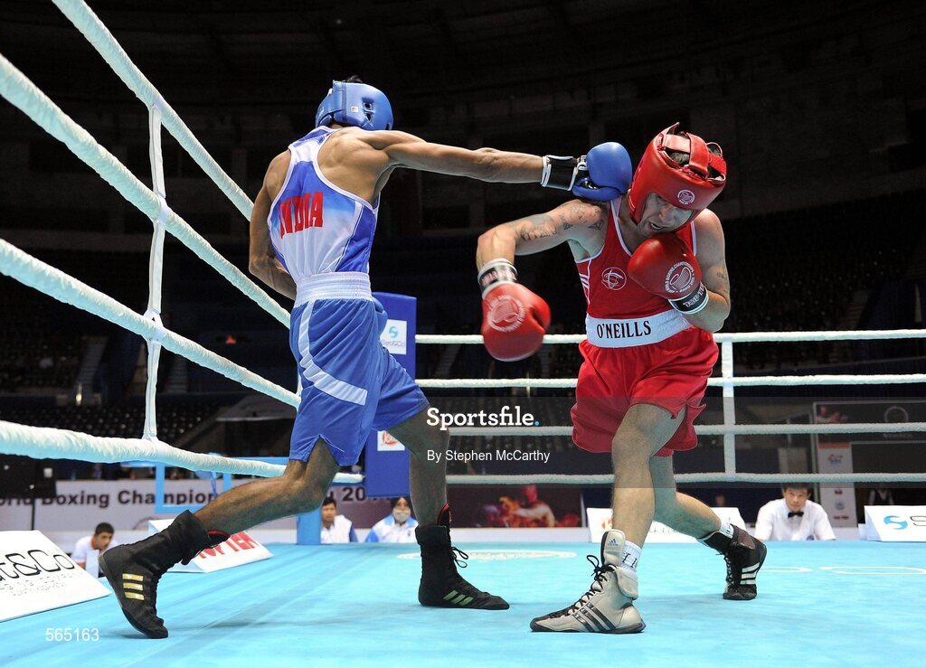 4 October 2011; David Oliver Joyce, St Michael's Athy B.C., Kildare, representing Ireland, right, exchanges punches with Jai Bhagwan, India, during their 60kg bout. Joyce was defeated 32-30. 2011 AIBA World Boxing Championships - Last 16, David Oliver Joyce v Jai Bhagwan. Heydar Aliyev Sports and Exhibition Complex, Baku, Azerbaijan. Picture credit: Stephen McCarthy / SPORTSFILE