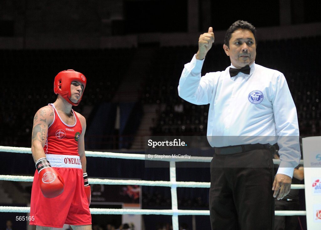 4 October 2011; David Oliver Joyce, St Michael's Athy B.C., Kildare, representing Ireland, receives a two-point penalty from referee Jones Kennedy Silva, Brazil, with four seconds remaining in his 60kg bout with Jai Bhagwan, India. Joyce was defeated 32-30. 2011 AIBA World Boxing Championships - Last 16, David Oliver Joyce v Jai Bhagwan. Heydar Aliyev Sports and Exhibition Complex, Baku, Azerbaijan. Picture credit: Stephen McCarthy / SPORTSFILE