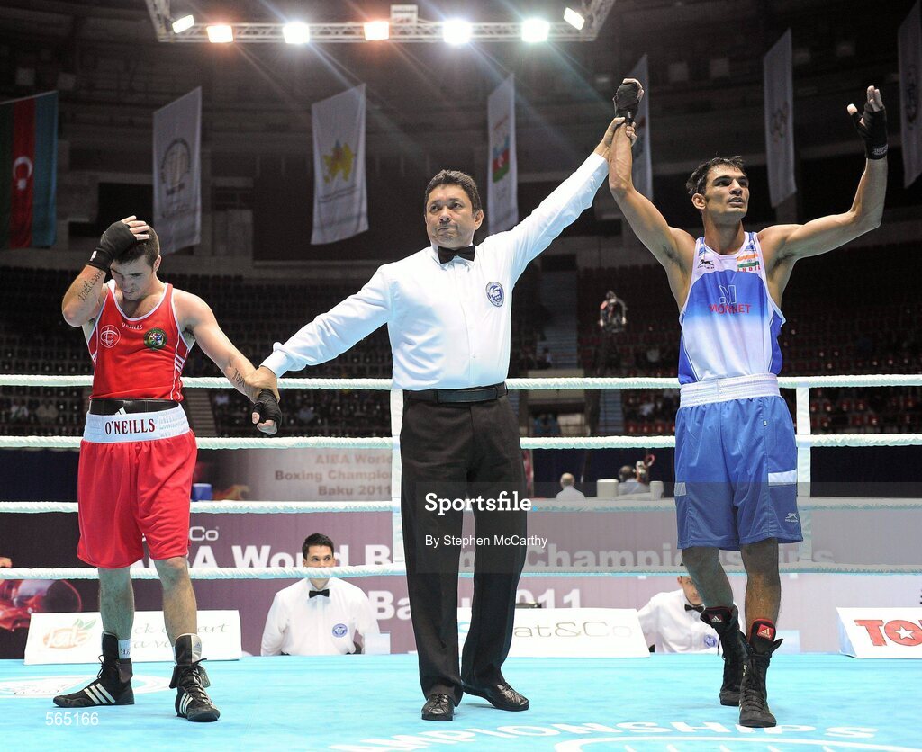 4 October 2011; Referee Jones Kennedy Silva, Brazil, raises the hand of Jai Bhagwan, India, following his 60kg victory over David Oliver Joyce, St Michael's Athy B.C., Kildare, representing Ireland. Joyce was defeated 32-30. 2011 AIBA World Boxing Championships - Last 16, David Oliver Joyce v Jai Bhagwan. Heydar Aliyev Sports and Exhibition Complex, Baku, Azerbaijan. Picture credit: Stephen McCarthy / SPORTSFILE