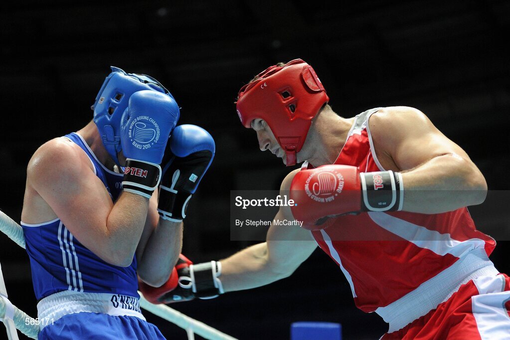 4 October 2011; Con Sheehan, Clonmel B.C., Tipperary, representing Ireland, left, exchanges punches with Roberto Cammerelle, Italy, during their 91+kg bout. Sheehan retired during the third round after visiting the medic twice. 2011 AIBA World Boxing Championships - Last 16, Con Sheehan v Roberto Cammerelle. Heydar Aliyev Sports and Exhibition Complex, Baku, Azerbaijan. Picture credit: Stephen McCarthy / SPORTSFILE