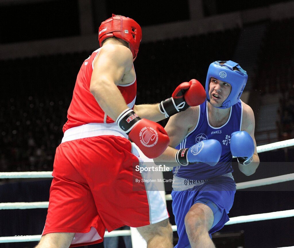 4 October 2011; Con Sheehan, Clonmel B.C., Tipperary, representing Ireland, right, exchanges punches with Roberto Cammerelle, Italy, during their 91+kg bout. Sheehan retired during the third round after visiting the medic twice. 2011 AIBA World Boxing Championships - Last 16, Con Sheehan v Roberto Cammerelle. Heydar Aliyev Sports and Exhibition Complex, Baku, Azerbaijan. Picture credit: Stephen McCarthy / SPORTSFILE
