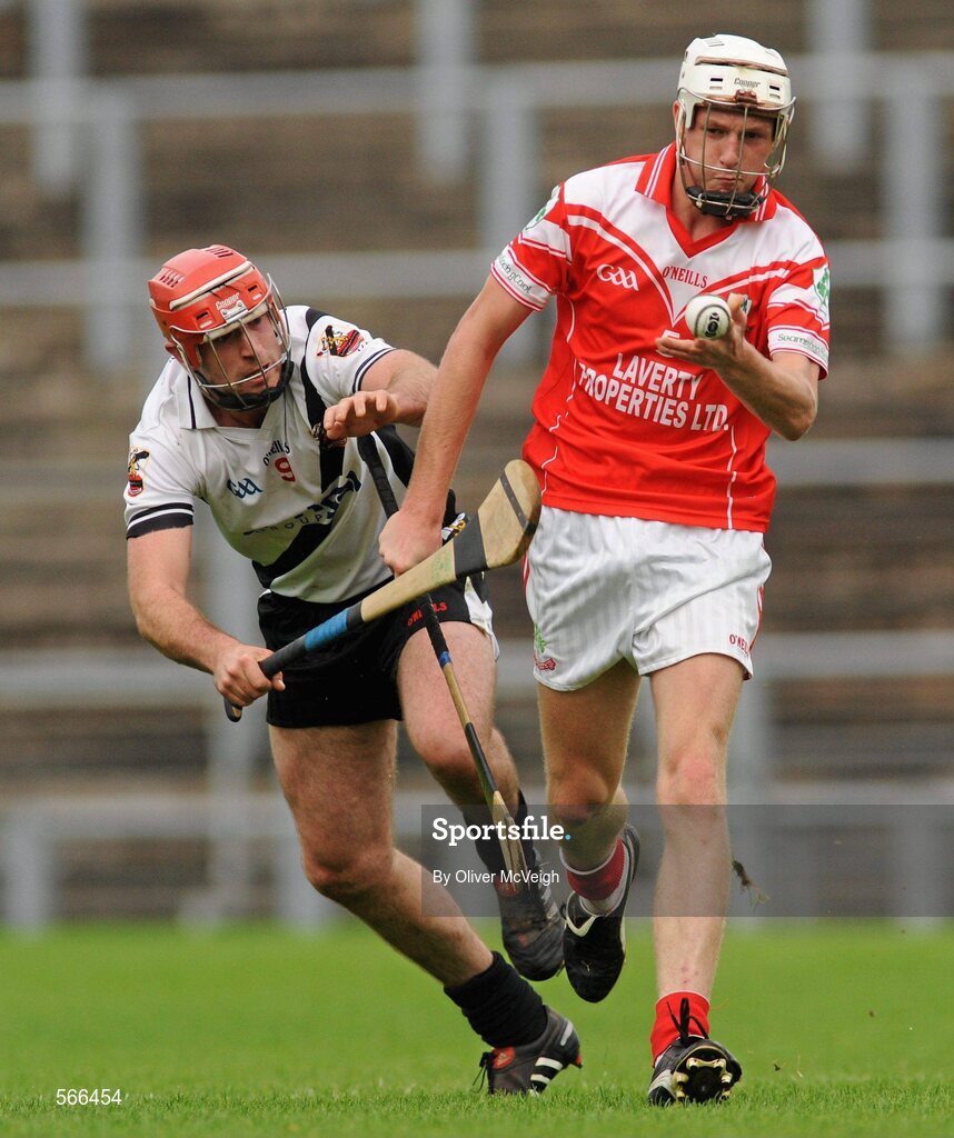9 October 2011; James Campbell, Loughgiel Shamrocks, in action against Mark Craig, Dungiven Kevin Lynchs. AIB GAA Hurling Ulster Senior Club Championship Semi-Final, Loughgiel v  Dungiven Kevin Lynchs, Casement Park, Belfast, Co. Antrim. Picture credit: Oliver McVeigh / SPORTSFILE