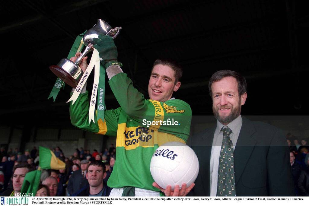 28 April 2002; Darragh O'Se, Kerry captain watched by Sean Kelly, President elect lifts the cup after victory over Laois, Kerry v Laois, Allianz League Division 2 Final, Gaelic Grounds, Limerick. Football. Picture credit; Brendan Moran / SPORTSFILE