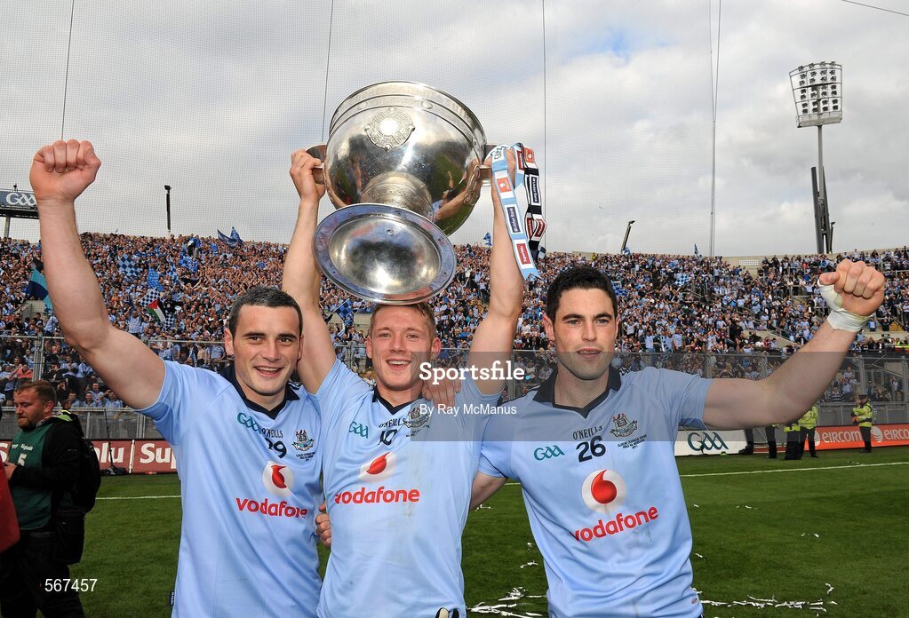 18 September 2011; Dublin players Paul Brogan, left, Paul Flynn, and Ross MCConnell, right, celebrate with the Sam Maguire cup after the game. GAA Football All-Ireland Senior Championship Final, Kerry v Dublin, Croke Park, Dublin. Picture credit: Ray McManus / SPORTSFILE