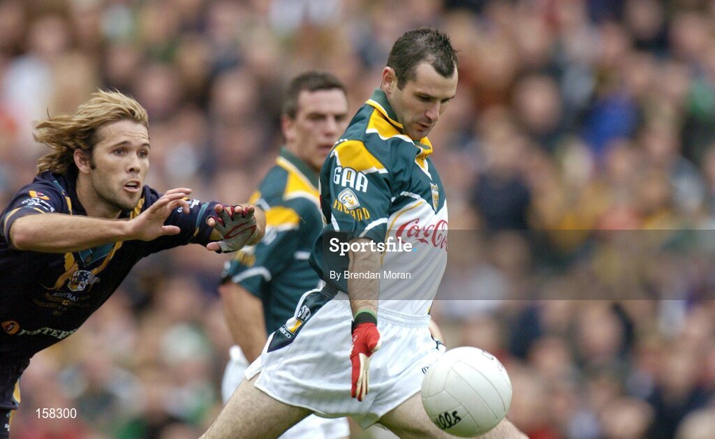 17 October 2004; Steven McDonnell, Ireland, on his way to scoring his sides first goal despite the tackle of Mark McVeigh, Australia. Coca Cola International Rules Series 2004, First Test, Ireland v Australia, Croke Park, Dublin. Picture credit; Brendan Moran / SPORTSFILE *** Local Caption *** Any photograph taken by SPORTSFILE during, or in connection with, the 2004 Coca Cola International Rules Series which displays GAA logos or contains an image or part of an image of any GAA intellectual property, or, which contains images of a GAA player/players in their playing uniforms, may only be used for editorial and non-advertising purposes.  Use of photographs for advertising, as posters or for purchase separately is strictly prohibited unless prior written approval has been obtained from the Gaelic Athletic Association.