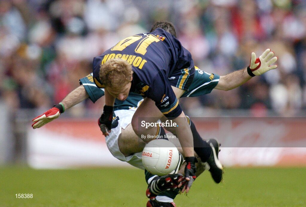17 October 2004; Jason Johnson, Australia, in action against Steven McDonnell, Ireland. Coca Cola International Rules Series 2004, First Test, Ireland v Australia, Croke Park, Dublin. Picture credit; Brendan Moran / SPORTSFILE *** Local Caption *** Any photograph taken by SPORTSFILE during, or in connection with, the 2004 Coca Cola International Rules Series which displays GAA logos or contains an image or part of an image of any GAA intellectual property, or, which contains images of a GAA player/players in their playing uniforms, may only be used for editorial and non-advertising purposes.  Use of photographs for advertising, as posters or for purchase separately is strictly prohibited unless prior written approval has been obtained from the Gaelic Athletic Association.