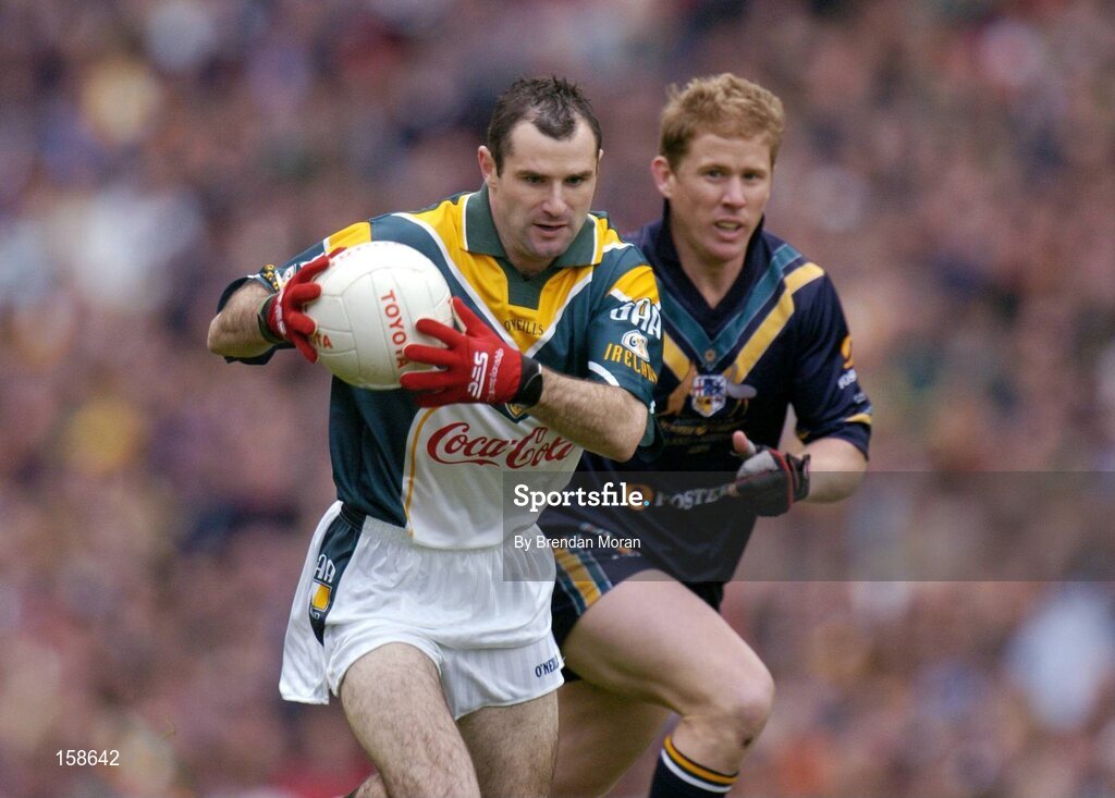 17 October 2004; Steven McDonnell, Ireland, in action against Jason Johnson, Australia. Coca Cola International Rules Series 2004, First Test, Ireland v Australia, Croke Park, Dublin. Picture credit; Brendan Moran / SPORTSFILE *** Local Caption *** Any photograph taken by SPORTSFILE during, or in connection with, the 2004 Coca Cola International Rules Series which displays GAA logos or contains an image or part of an image of any GAA intellectual property, or, which contains images of a GAA player/players in their playing uniforms, may only be used for editorial and non-advertising purposes.  Use of photographs for advertising, as posters or for purchase separately is strictly prohibited unless prior written approval has been obtained from the Gaelic Athletic Association.