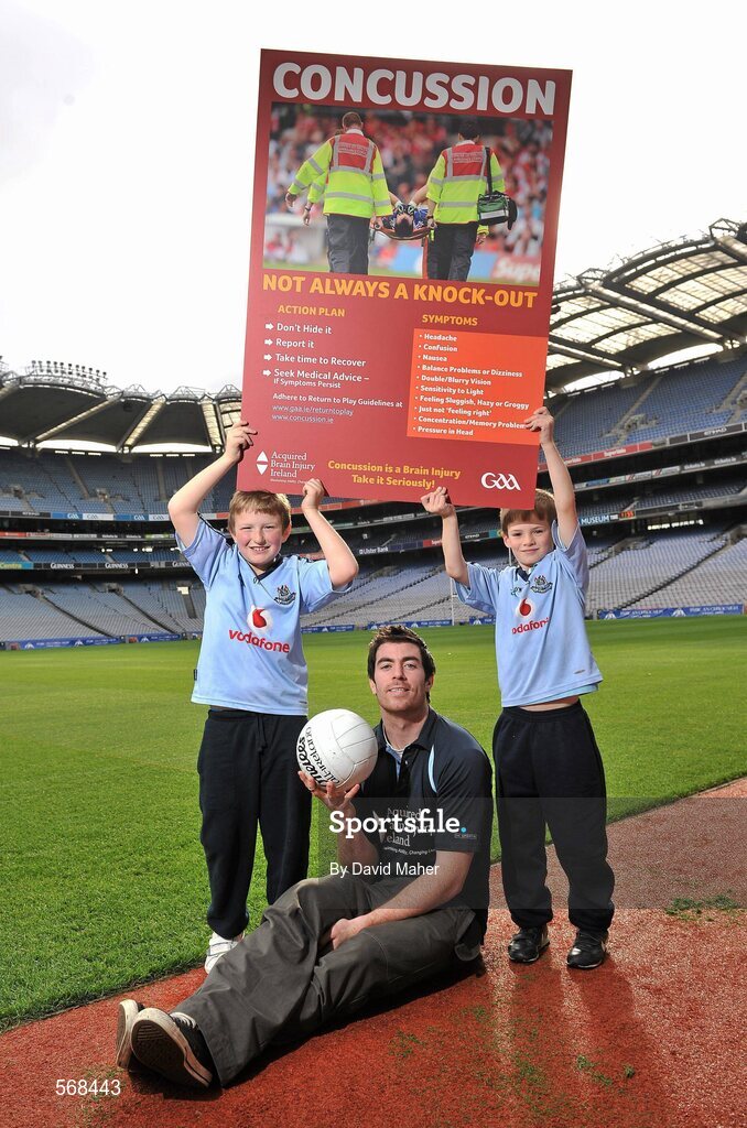 19 October 2011; The GAA has teamed up with brain injury specialists Acquired Brain Injury Ireland to back their Mind Your Head campaign; educating players about the signs and symptoms of Concussion, through an Educational Concussion Poster Campaign. This poster campaign will be distributed to over 1800 GAA clubs throughout the country, reaching out to all players of every age and level. Present at the launch were Dublin Footballer and ABI Ireland Ambassadors Michael Darragh Macauley, with Sean O'Connell, left, age 9 from Stepaside, Co. Dublin and Mark Bailey, age 8 from Killiney, Co. Dublin. GAA and ABI Ireland Launch Concussion Awareness Campaign, Croke Park, Dublin. Picture credit: David Maher / SPORTSFILE