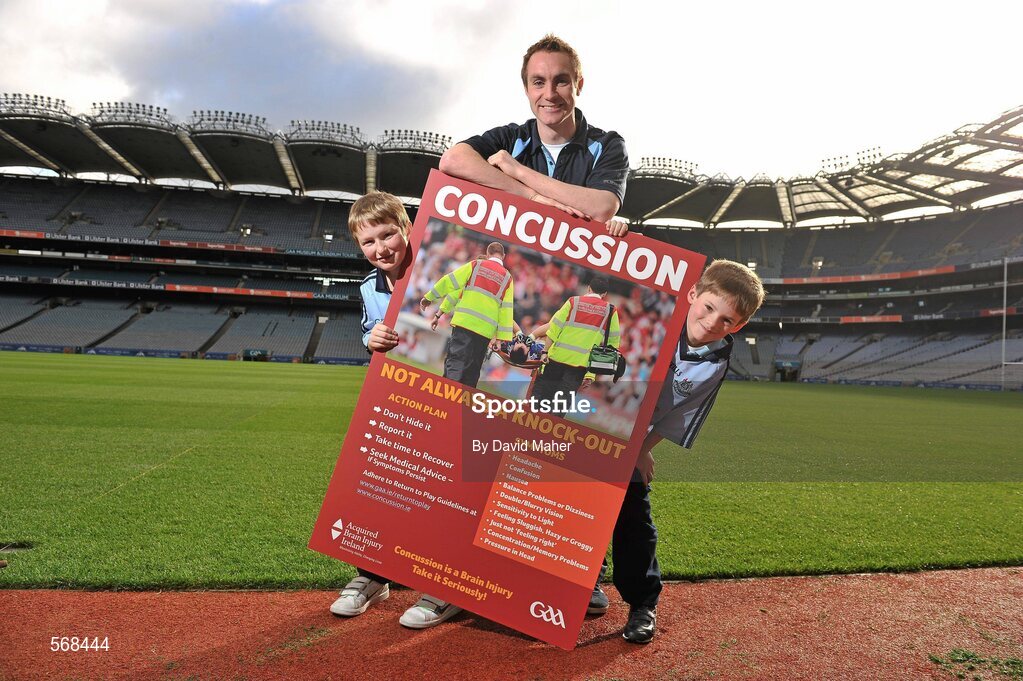 19 October 2011; The GAA has teamed up with brain injury specialists Acquired Brain Injury Ireland to back their Mind Your Head campaign; educating players about the signs and symptoms of Concussion, through an Educational Concussion Poster Campaign. This poster campaign will be distributed to over 1800 GAA clubs throughout the country, reaching out to all players of every age and level. Present at the launch were Dublin Footballer and ABI Ireland Ambassadors Michael Darragh Macauley, with Sean O'Connell, left, age 9 from Stepaside, Co. Dublin and Mark Bailey, age 8 from Killiney, Co. Dublin. GAA and ABI Ireland Launch Concussion Awareness Campaign, Croke Park, Dublin. Picture credit: David Maher / SPORTSFILE