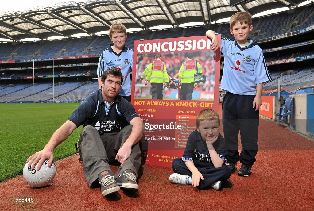 19 October 2011; The GAA has teamed up with brain injury specialists Acquired Brain Injury Ireland to back their Mind Your Head campaign; educating players about the signs and symptoms of Concussion, through an Educational Concussion Poster Campaign. This poster campaign will be distributed to over 1800 GAA clubs throughout the country, reaching out to all players of every age and level. Present at the launch were Dublin Footballer and ABI Ireland Ambassadors Michael Darragh Macauley, with children, left to right, Sean O'Connell, age 9, from Stepaside, Co. Dublin, his brother James O'Connell, age 5, and Mark Bailey, age 8, from Killiney, Co. Dublin. GAA and ABI Ireland Launch Concussion Awareness Campaign, Croke Park, Dublin. Picture credit: David Maher / SPORTSFILE