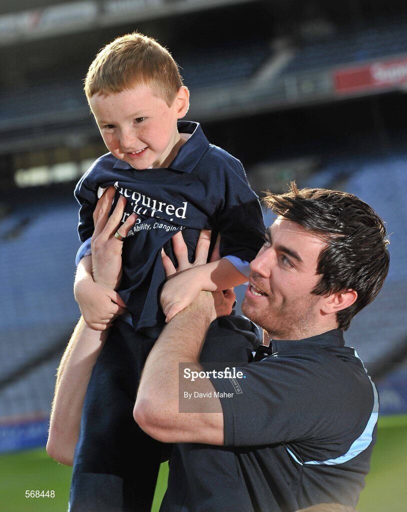 19 October 2011; The GAA has teamed up with brain injury specialists Acquired Brain Injury Ireland to back their Mind Your Head campaign; educating players about the signs and symptoms of Concussion, through an Educational Concussion Poster Campaign. This poster campaign will be distributed to over 1800 GAA clubs throughout the country, reaching out to all players of every age and level. Present at the launch was Dublin Footballer and ABI Ireland Ambassadors Michael Darragh Macauley, with James O'Connell, age 5, from Stepaside, Co. Dublin. GAA and ABI Ireland Launch Concussion Awareness Campaign, Croke Park, Dublin. Picture credit: David Maher / SPORTSFILE