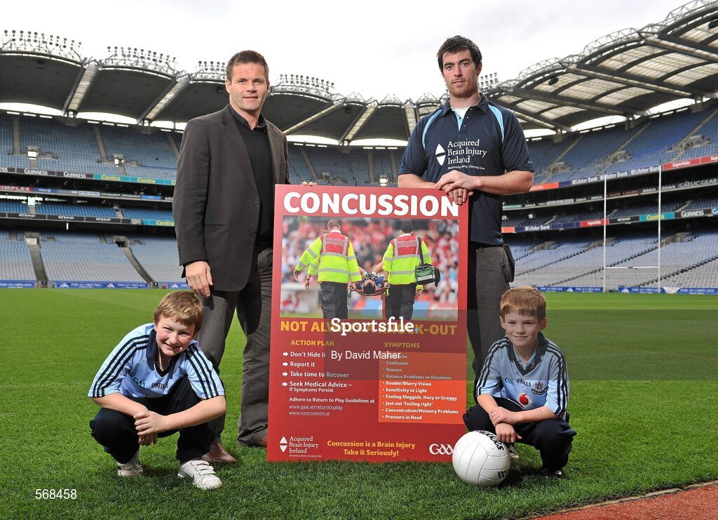 19 October 2011; The GAA has teamed up with brain injury specialists Acquired Brain Injury Ireland to back their Mind Your Head campaign; educating players about the signs and symptoms of Concussion, through an Educational Concussion Poster Campaign. This poster campaign will be distributed to over 1800 GAA clubs throughout the country, reaching out to all players of every age and level. Present at the launch were GPA CEO Dessie Farrell, with Dublin footballer and ABI Ireland ambassador Michael Darragh Macauley, with Sean O'Connell, left, age 9, from Stepaside, Co. Dublin, and Mark Bailey, age 8, from Killiney, Co. Dublin. GAA and ABI Ireland Launch Concussion Awareness Campaign, Croke Park, Dublin. Picture credit: David Maher / SPORTSFILE