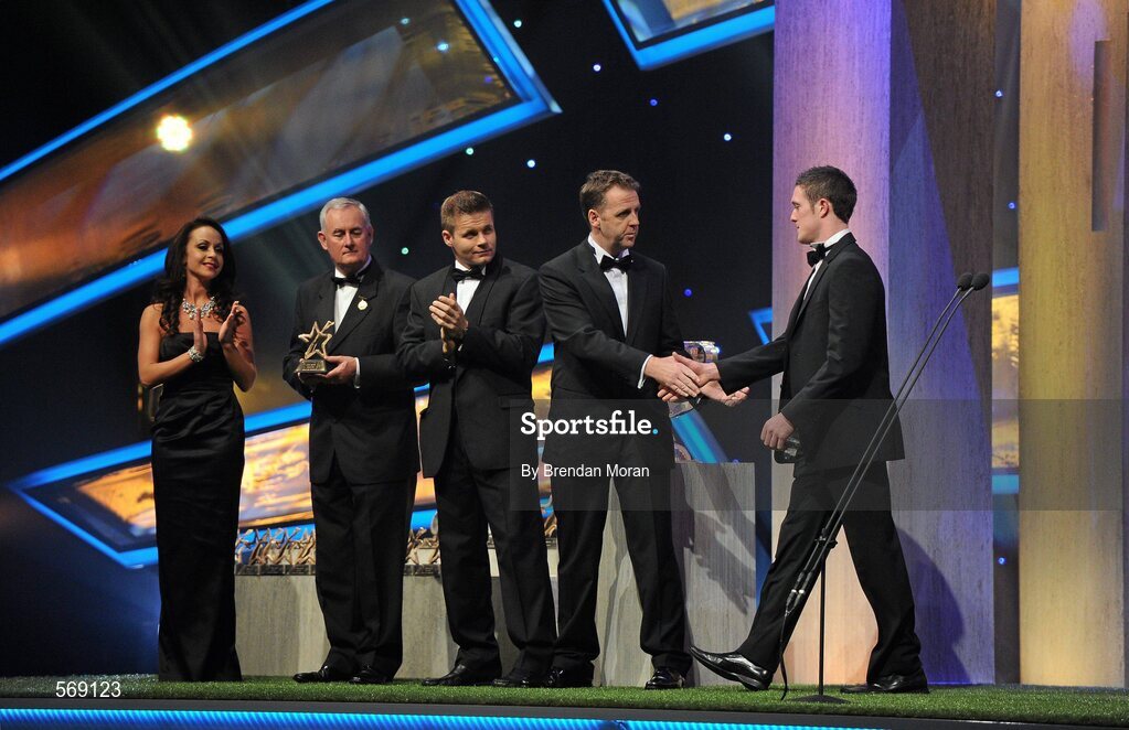 21 October 2011; Tipperary's Michael Cahill is greeted by Dave Sheeran, Managing Director, Opel Ireland and Dessie Farrell, Chief Executive of the GPA, before receiving his award from Uachtarán CLG Criostóir Ó Cuana at the GAA GPA All-Star Awards 2011 sponsored by Opel. National Convention Centre, Dublin. Picture credit: Brendan Moran / SPORTSFILE