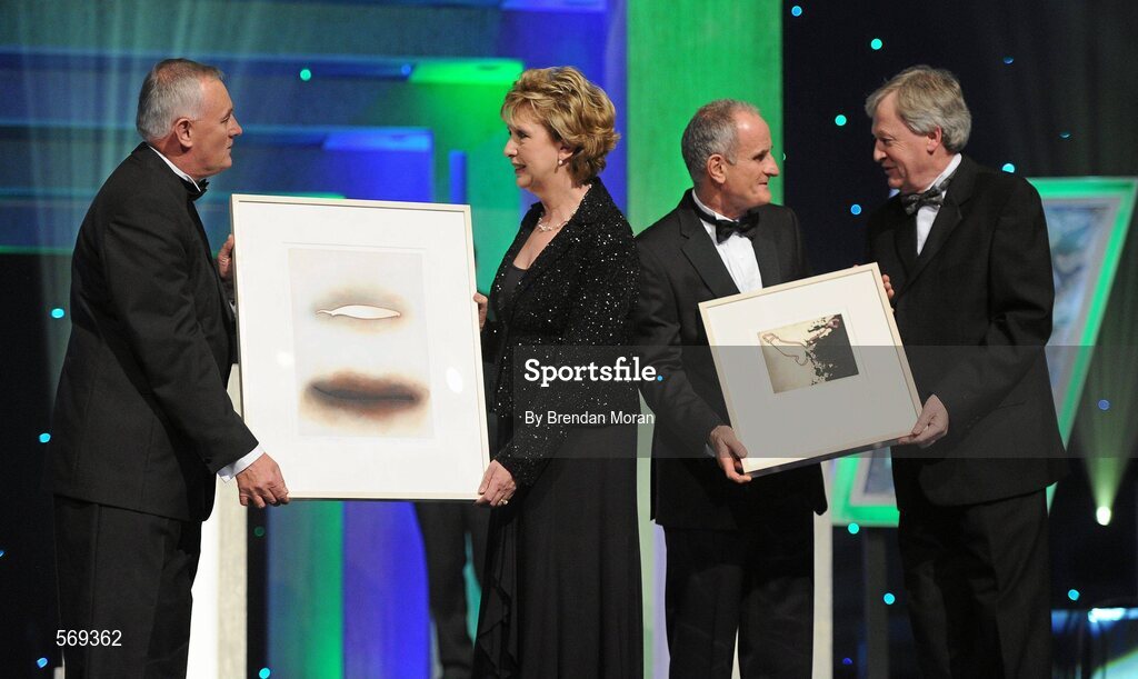 21 October 2011; Uachtarán CLG Criostóir Ó Cuana, and Ard Stiúrthóir of the GAA Páraic Duffy make a presentation, on behalf of the GAA, to President Mary McAleese and her husband Martin McAleese to recognise the contribution of the President to the GAA and Ireland during her term of office, at the GAA GPA All-Star Awards 2011 sponsored by Opel. National Convention Centre, Dublin. Picture credit: Brendan Moran / SPORTSFILE