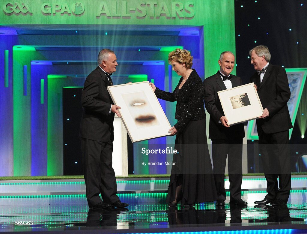 21 October 2011; Uachtarán CLG Criostóir Ó Cuana, and Ard Stiúrthóir of the GAA Páraic Duffy make a presentation, on behalf of the GAA, to President Mary McAleese and her husband Martin McAleese to recognise the contribution of the President to the GAA and Ireland during her term of office, at the GAA GPA All-Star Awards 2011 sponsored by Opel. National Convention Centre, Dublin. Picture credit: Brendan Moran / SPORTSFILE