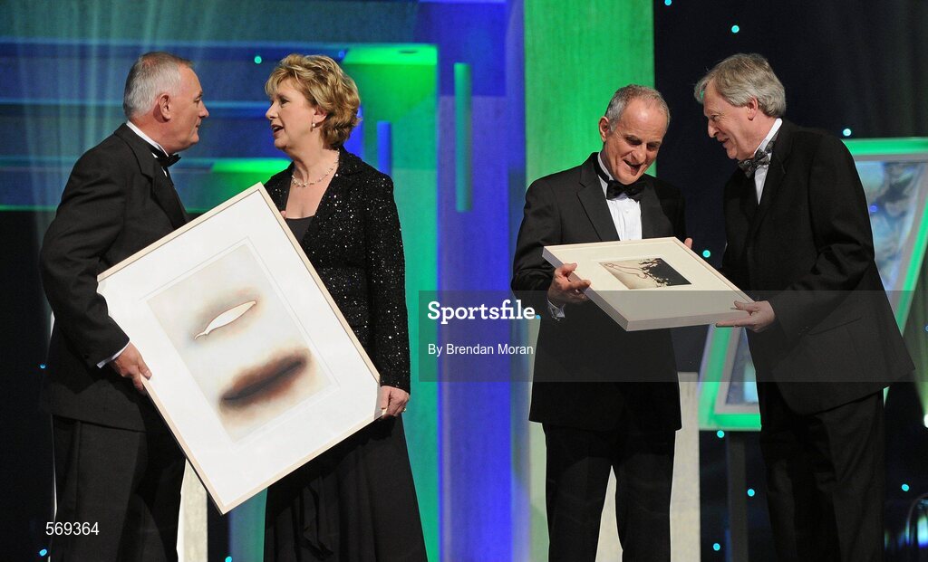 21 October 2011; Uachtarán CLG Criostóir Ó Cuana, and Ard Stiúrthóir of the GAA Páraic Duffy make a presentation, on behalf of the GAA, to President Mary McAleese and her husband Martin McAleese to recognise the contribution of the President to the GAA and Ireland during her term of office, at the GAA GPA All-Star Awards 2011 sponsored by Opel. National Convention Centre, Dublin. Picture credit: Brendan Moran / SPORTSFILE