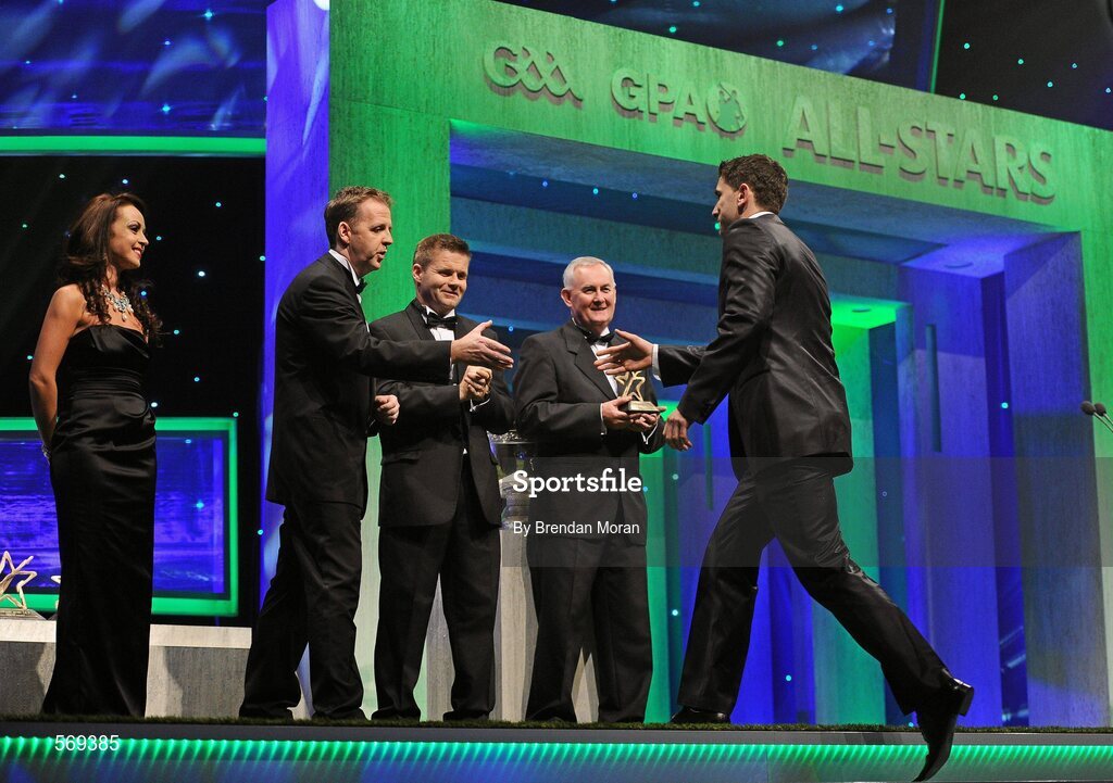 21 October 2011; Dublin footbeller Bernard Brogan is greeted by Dave Sheeran, Managing Director, Opel Ireland, before receiving his award from Uachtarán CLG Criostóir Ó Cuana at the GAA GPA All-Star Awards 2011 sponsored by Opel. National Convention Centre, Dublin. Picture credit: Brendan Moran / SPORTSFILE