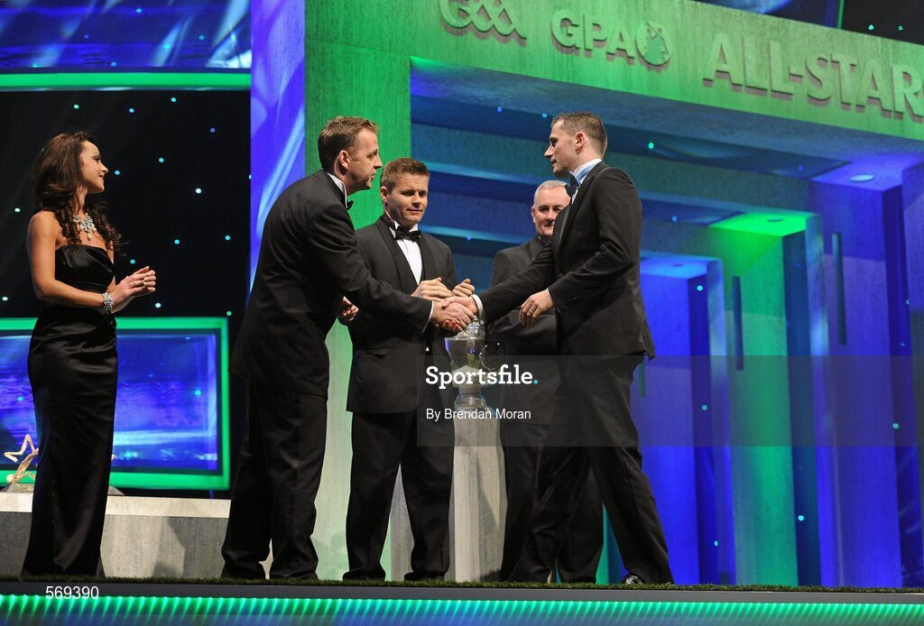 21 October 2011; Dublin footballer Alan Brogan is greeted by Dave Sheeran, Managing Director, Opel Ireland, before receiving his award from Uachtarán CLG Criostóir Ó Cuana at the GAA GPA All-Star Awards 2011 sponsored by Opel. National Convention Centre, Dublin. Picture credit: Brendan Moran / SPORTSFILE