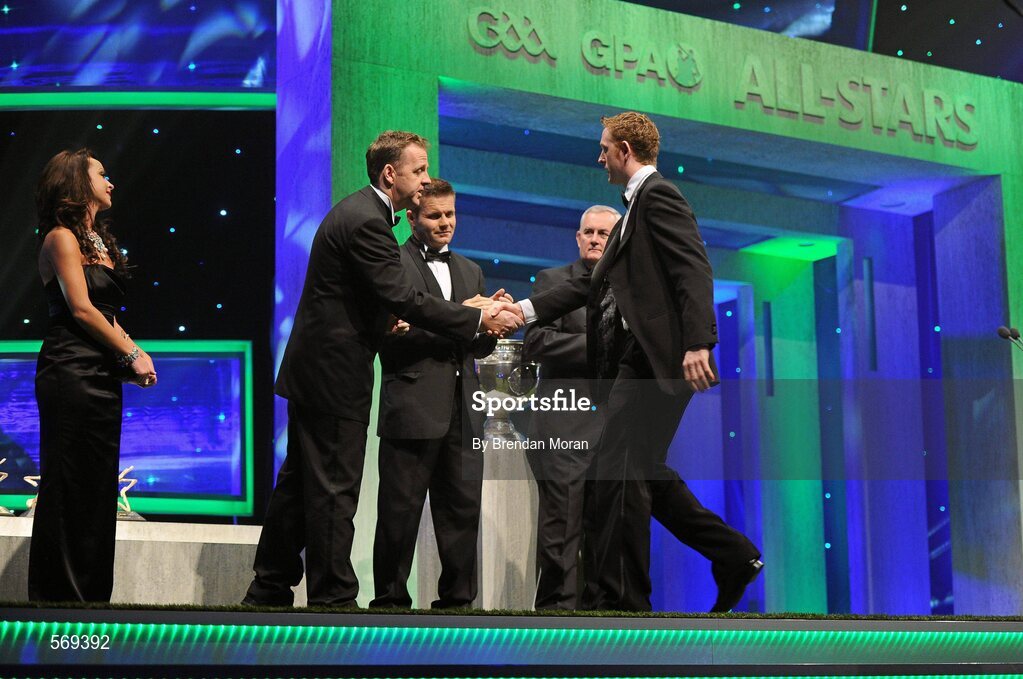 21 October 2011; Kerry footballer Colm Cooper is greeted by Dave Sheeran, Managing Director, Opel Ireland, before receiving his award from Uachtarán CLG Criostóir Ó Cuana at the GAA GPA All-Star Awards 2011 sponsored by Opel. National Convention Centre, Dublin. Picture credit: Brendan Moran / SPORTSFILE