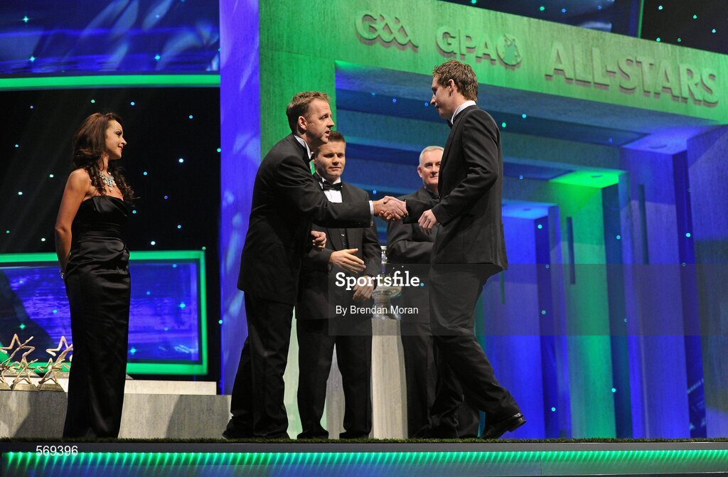 21 October 2011; Dublin footballer Kevin Nolan is greeted by Dave Sheeran, Managing Director, Opel Ireland, before receiving his award from Uachtarán CLG Criostóir Ó Cuana at the GAA GPA All-Star Awards 2011 sponsored by Opel. National Convention Centre, Dublin. Picture credit: Brendan Moran / SPORTSFILE
