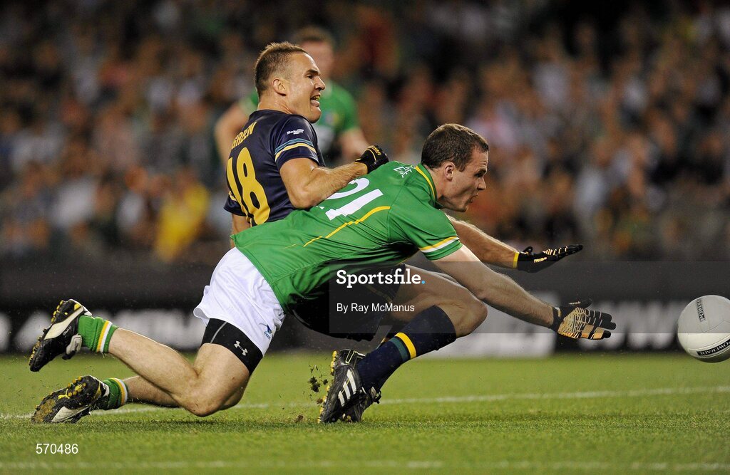 28 October 2011; The Australia captain Brad Green shoots past Ireland's Neil McGee to score a goal in the second quarter. International Rules 1st Test, Australia v Ireland, Etihad Stadium, Melbourne, Australia. Picture credit: Ray McManus / SPORTSFILE