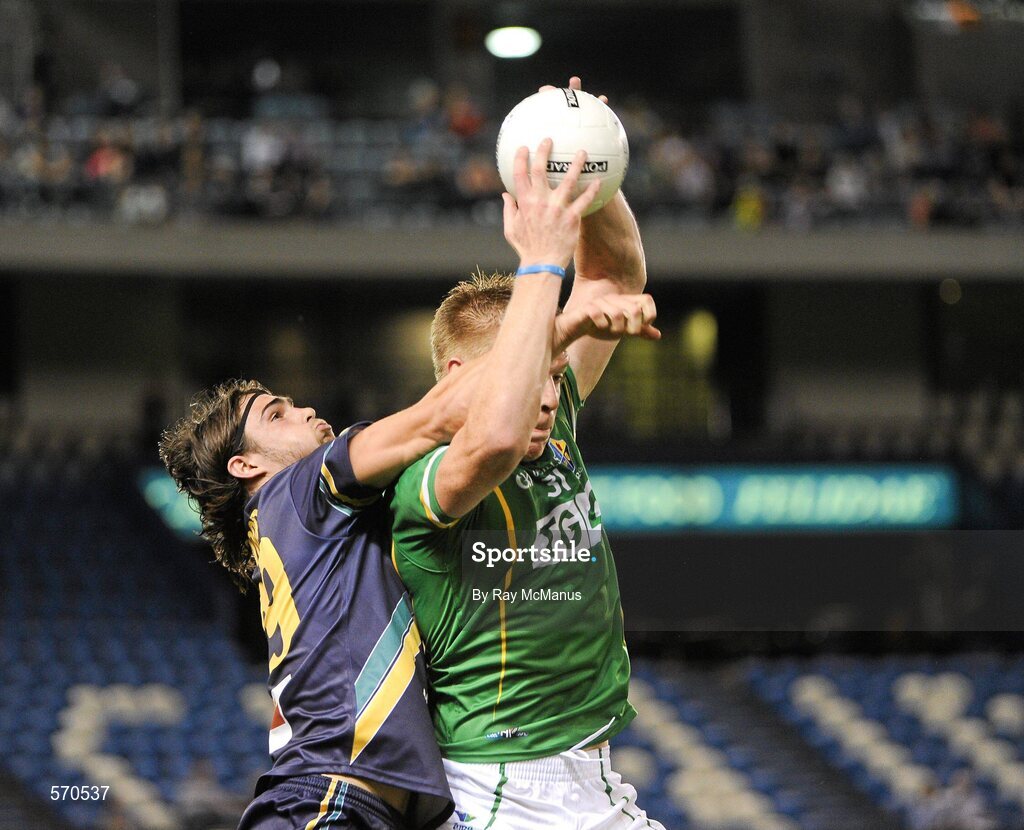 28 October 2011; Ireland's Tommy Walsh takes a mark under pressure from Australia's against Easton Wood. International Rules 1st Test, Australia v Ireland, Etihad Stadium, Melbourne, Australia. Picture credit: Ray McManus / SPORTSFILE