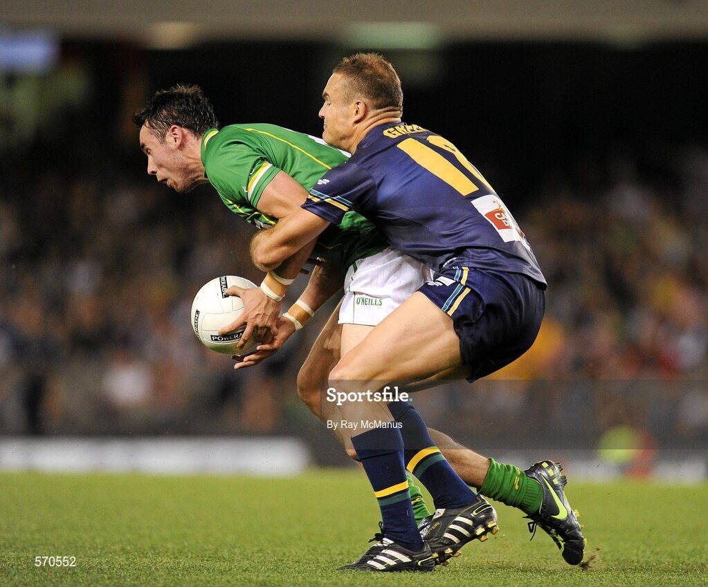 28 October 2011; Finnian Hanley, Ireland, is tackled by the Australian captain Brad Green. International Rules 1st Test, Australia v Ireland, Etihad Stadium, Melbourne, Australia. Picture credit: Ray McManus / SPORTSFILE