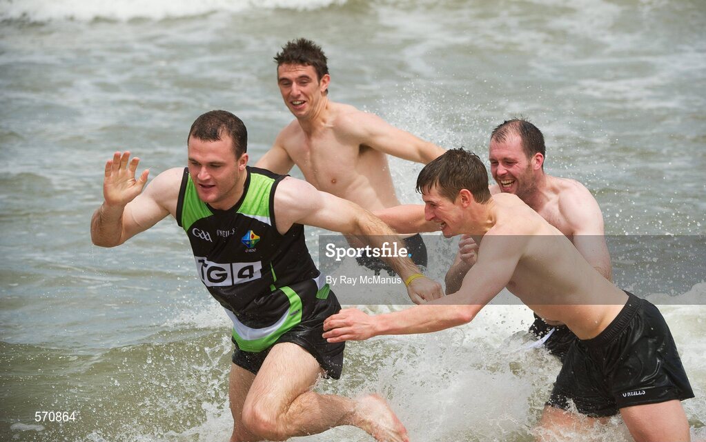 30 October 2011; Neil McGee avoids the clutches of Darren Hughes, Ciaran McKeever and Colm Begley as members of the Ireland  International Rules Series 2011 team splash about St Kilda Beach, Melbourne Bay, Australia. Picture credit: Ray McManus / SPORTSFILE