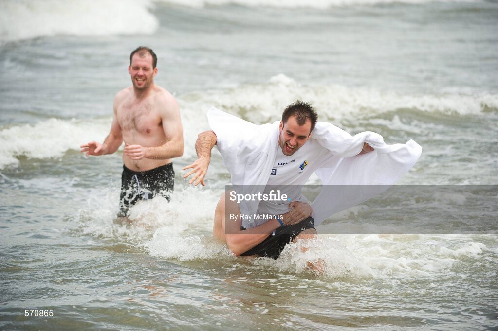 30 October 2011; Vice-captain Ciaran McKeever looks on as  Karl Lacey is tackled by Darren Hughes when members of the Ireland  International Rules Series 2011 team splash about on St Kilda Beach, Melbourne Bay, Australia. Picture credit: Ray McManus / SPORTSFILE