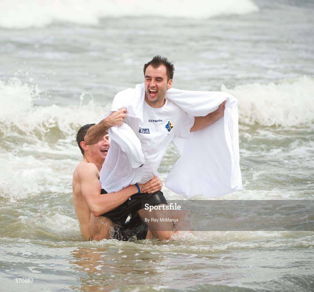 30 October 2011; Karl Lacey is tackled by Darren Hughes as members of the Ireland  International Rules Series 2011 team splash about St Kilda Beach, Melbourne Bay, Australia. Picture credit: Ray McManus / SPORTSFILE