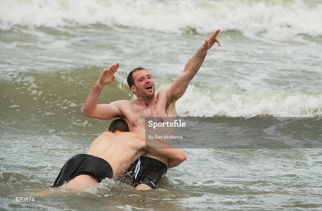 30 October 2011; Vice-captain Kieran McKeever is tackled by Darren Hughes as members of the Ireland International Rules Series 2011 team splash about on St Kilda Beach, Melbourne Bay, Australia. Picture credit: Ray McManus / SPORTSFILE