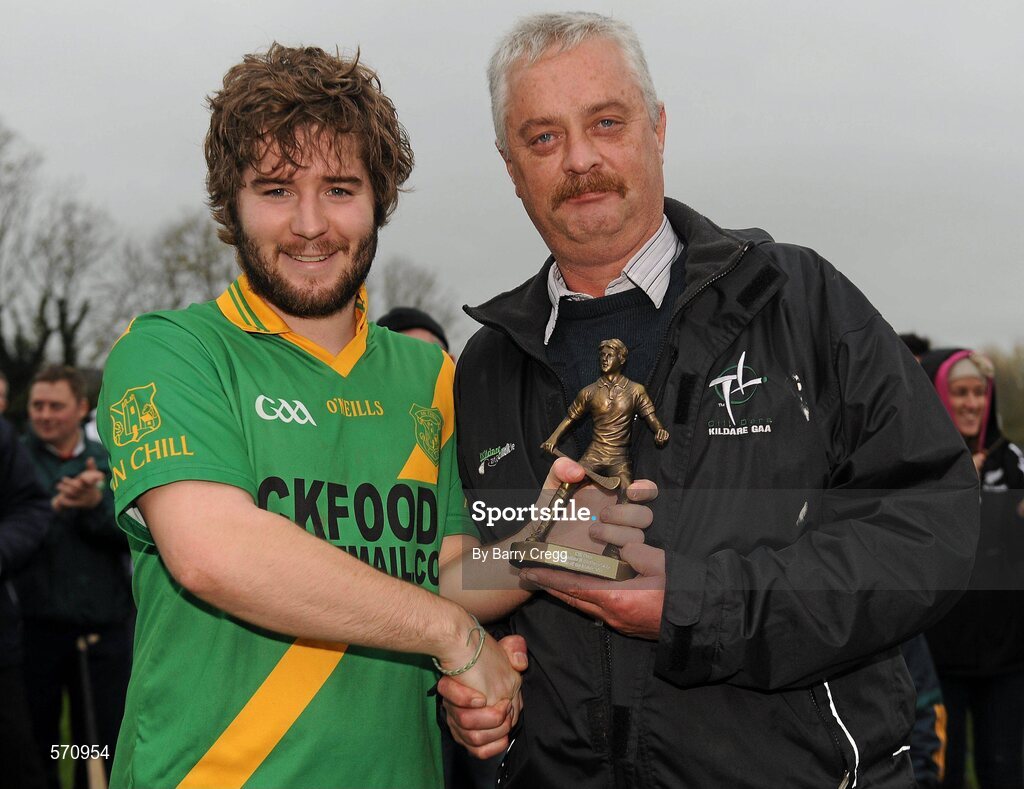30 October 2011; Ross Murphy, Kill, receives the Man of the Match award from Secretary of the Kildare Hurling Board Aidan Sinnott after the game. Intermediate B Championship Final, Kill v Confey, Naas GAA Ground, Co. Kildare. Picture credit: Barry Cregg / SPORTSFILE