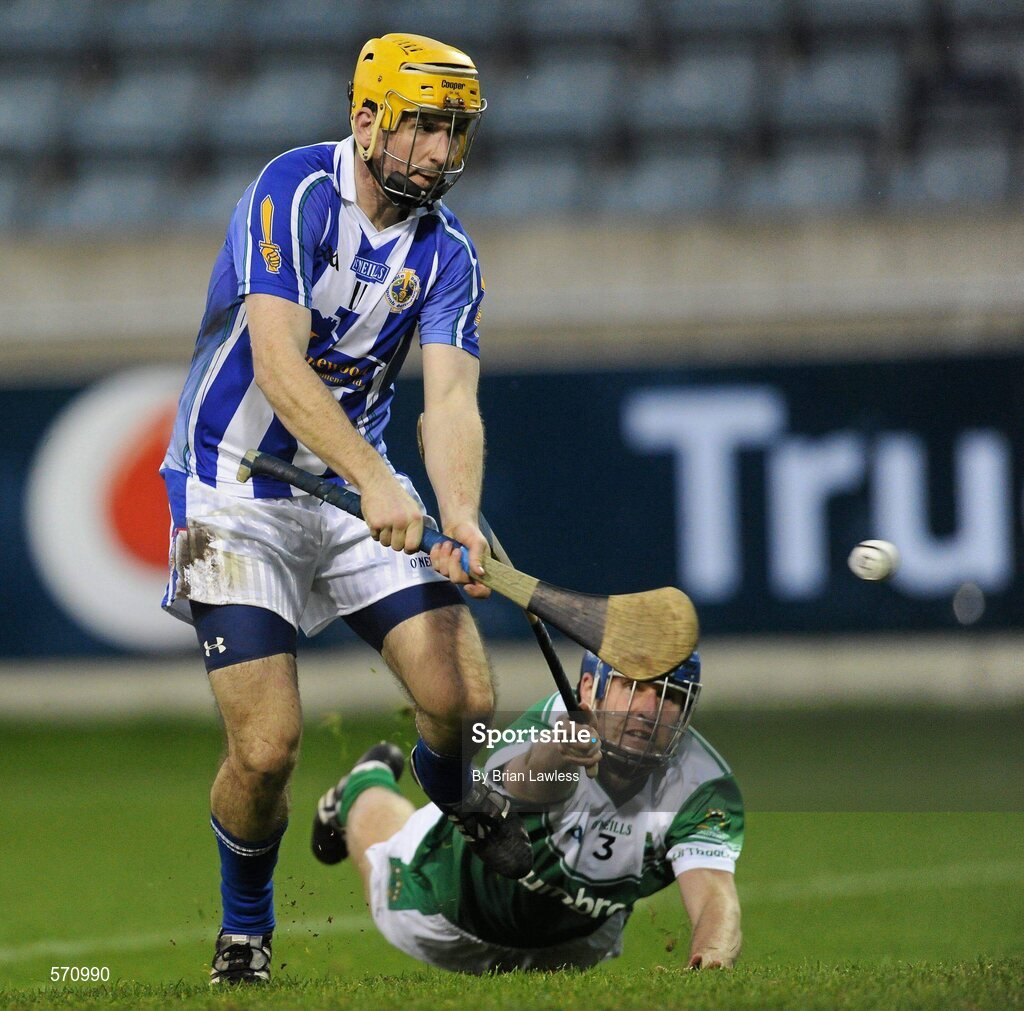 30 October 2011; Conor McCormack, Ballyboden St Enda's, shoots to score his side's third goal despite Michael Cunningham, O'Toole's. Dublin County Senior Huling Championship Final, Ballyboden St Enda's v O'Toole's, Parnell Park, Dublin. Picture credit: Brian Lawless / SPORTSFILE