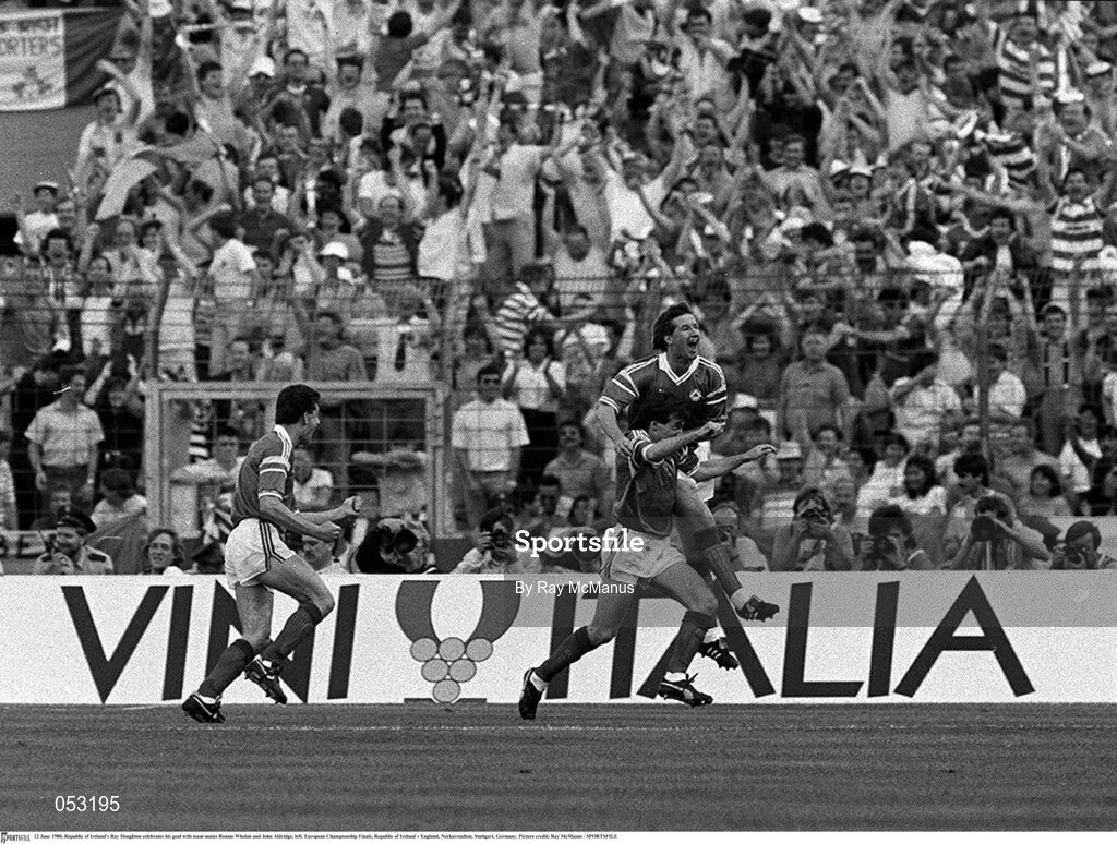 12 June 1988; Ray Houghton of Republic of Ireland celebrates his goal with team-mates Ronnie Whelan and John Aldridge, left, during the UEFA European Football Championship Finals Group B match between England and Republic of Ireland at Neckarstadion in Stuttgart, Germany. Photo by Ray McManus/Sportsfile