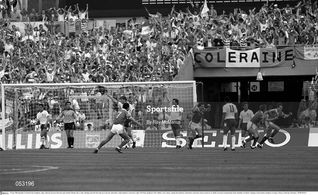12 June 1988; Ray Houghton, right, of Republic of Ireland celebrates his goal with team-mates Ronnie Whelan, left, as John Aldridge and Paul McGrath run to join the celebrations, while England players, from left, Neil Webb, goalkeeper Peter Shilton, Tony Adams, captain Bryan Robson, John Barnes and Kenny Samson claim for an offside during the UEFA European Football Championship Finals Group B match between England and Republic of Ireland at Neckarstadion in Stuttgart, Germany. Photo by Ray McManus/Sportsfile