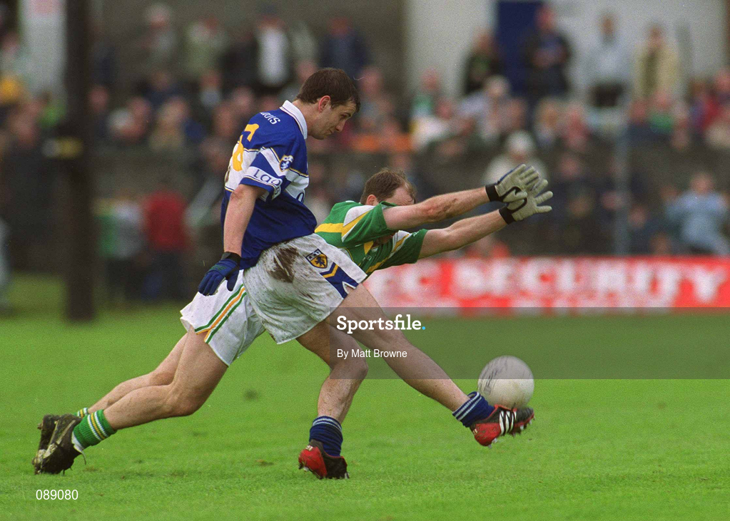 26 May 2002; Offaly's Finbar Cullen attempts to block Laois's Kevin Fitzpatrick during the Bank of Ireland Leinster Senior Football Championship Quarter-Final match between Offaly and Laois at O'Connor Park in Tullamore, Offaly. Photo by Matt Browne/Sportsfile
