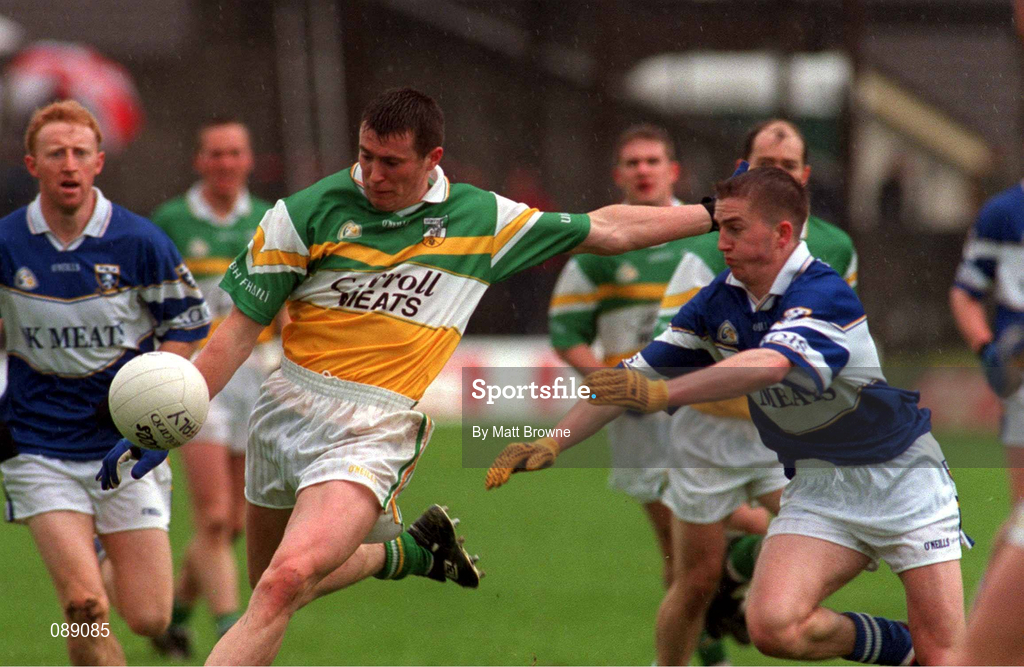 26 May 2002; Ciarán McManus of Offaly in action against  Joe Higgins of Laois during the Bank of Ireland Leinster Senior Football Championship Quarter-Final match between Offaly and Laois at O'Connor Park in Tullamore, Offaly. Photo by Matt Browne/Sportsfile