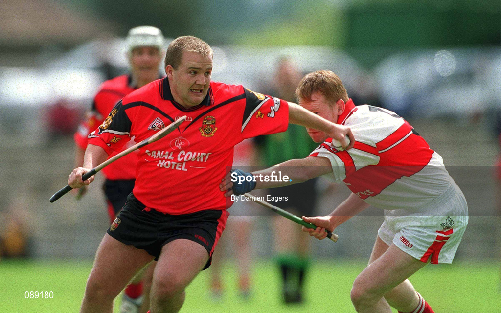25 May 2002; Johnny McGrattan of Down in action against Gregory Bruton of Derry during the Guinness Ulster Senior Hurling Championship Semi-Final match between Down and Derry at Casement Park in Belfast. Photo by Damien Eagers/Sportsfile