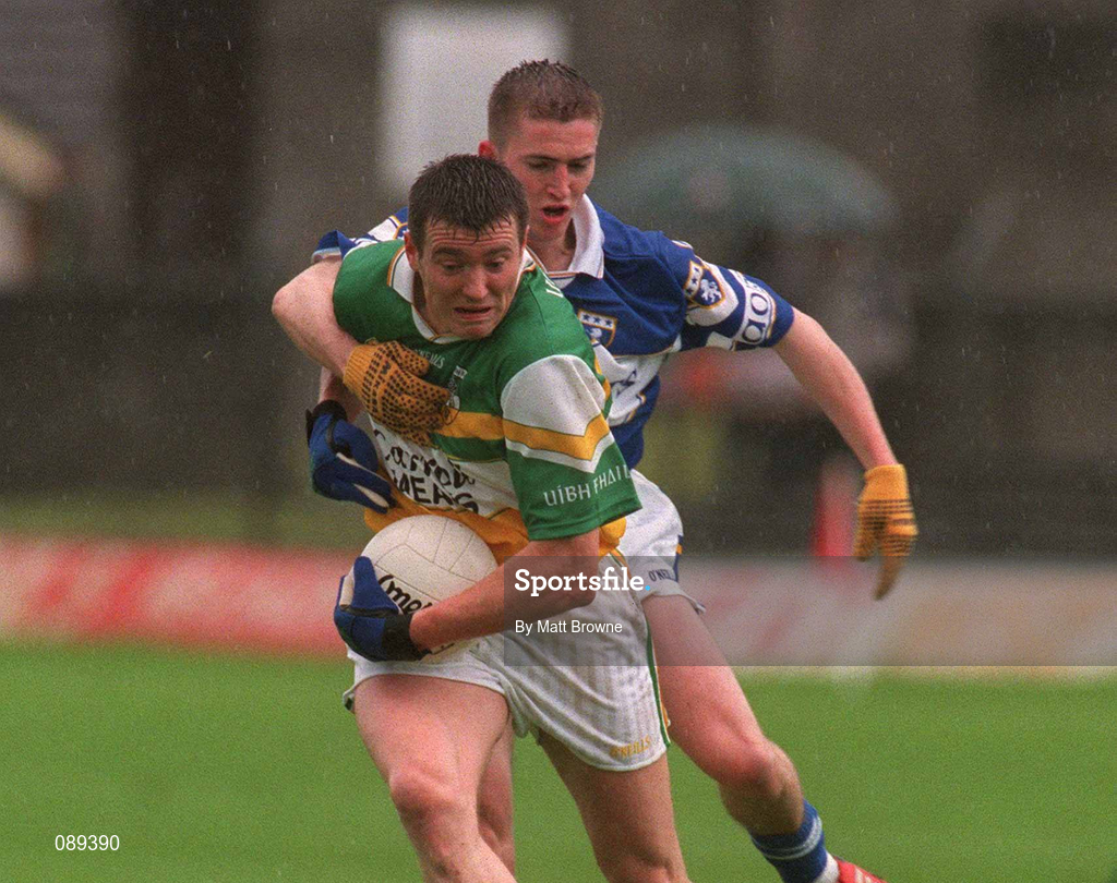 26 May 2002; Ciaran McManus of Offaly in action against Joe Higgins of Laois during the Bank of Ireland Leinster Senior Football Championship Quarter-Final match between Offaly and Laois at O'Connor Park in Tullamore, Offaly. Photo by Matt Browne/Sportsfile