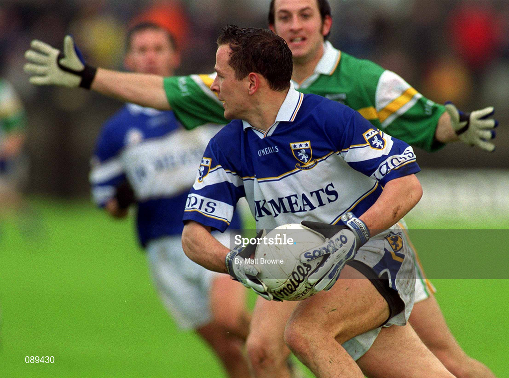 26 May 2002; Tom Kelly of Laois in action against Offaly's Roy Malone during the Bank of Ireland Leinster Senior Football Championship Quarter-Final match between Offaly and Laois at O'Connor Park in Tullamore, Offaly. Photo by Matt Browne/Sportsfile