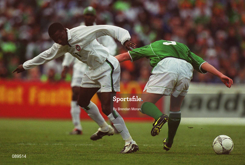 16 May 2002; Julius Aghahowa of Nigeria in action against the Republic of Ireland's Ian Harte during the International Friendly match between Republic of Ireland and Nigeria at Lansdowne Road in Dublin. Photo by Brendan Moran/Sportsfile