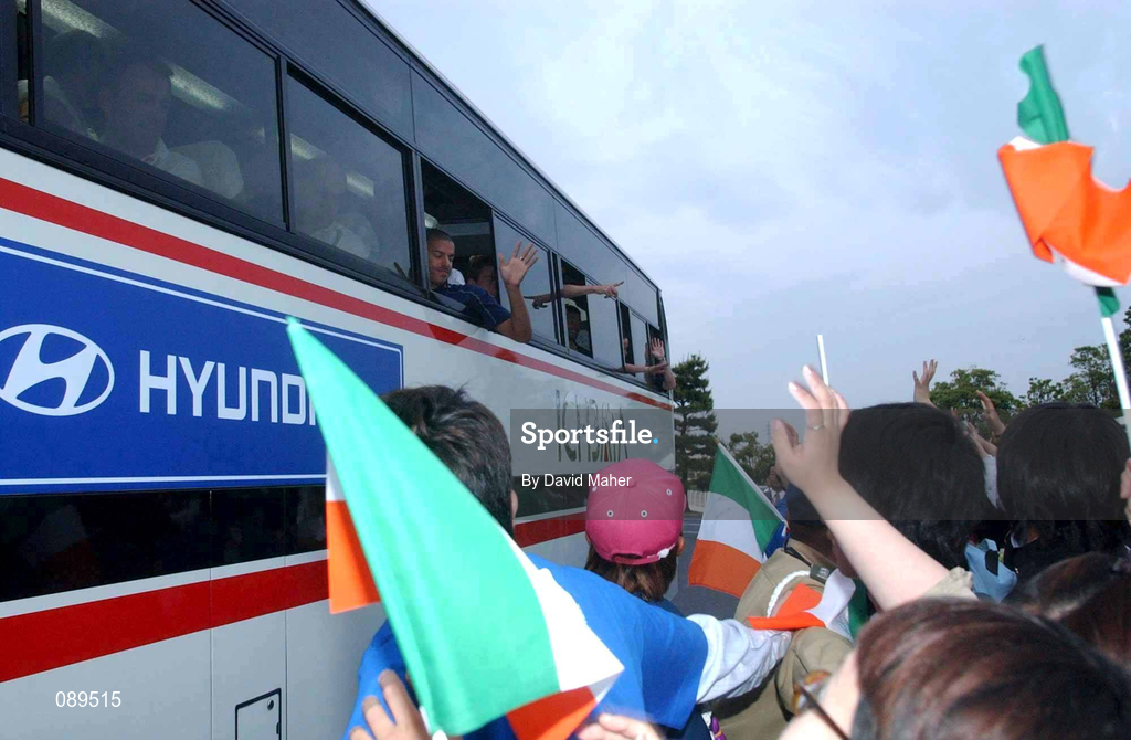 30 May 2002; Local supporters cheer on the Republic of Ireland players as the team bus leaves following a farewell ceremony at Izumo Sports Park in Izumo, Japan, ahead of their first FIFA World Cup 2002 Group E match against Cameroon. Photo by David Maher/Sportsfile