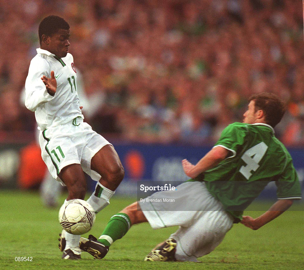 16 May 2002; Pius Ikedia of Nigeria in action against the Republic of Ireland's Kenny Cunningham during the International Friendly match between Republic of Ireland and Nigeria at Lansdowne Road in Dublin. Photo by Brendan Moran/Sportsfile