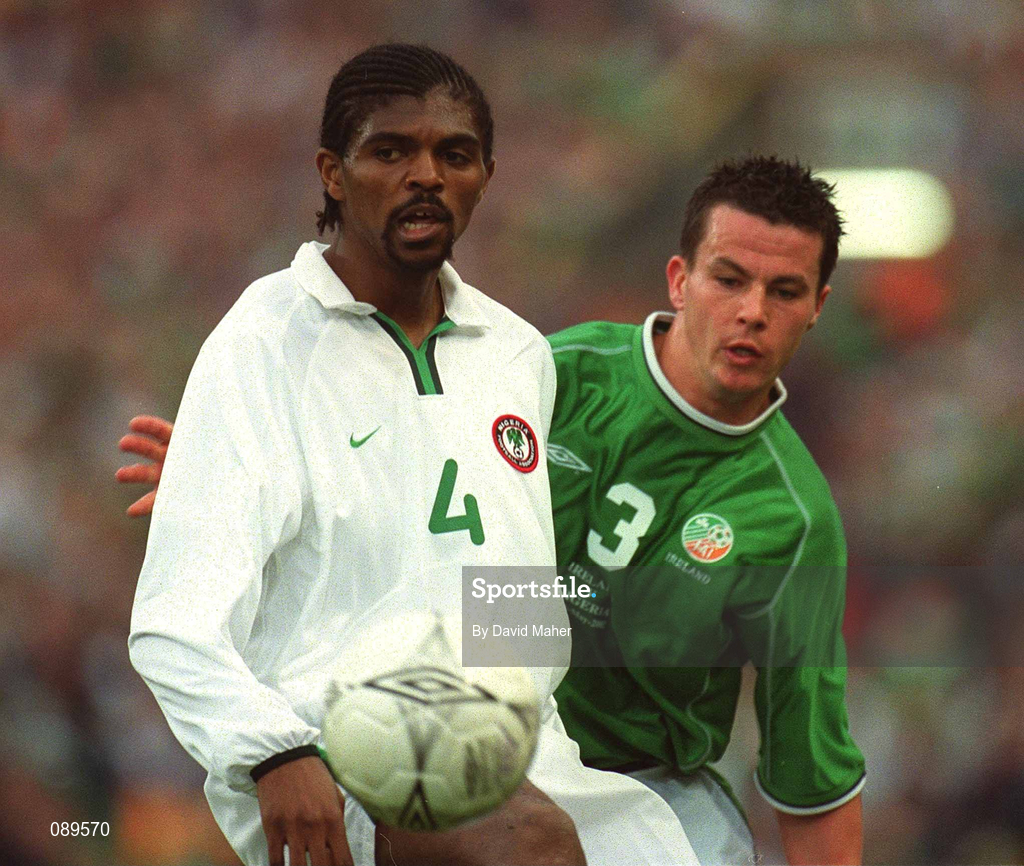 16 May 2002; Nwankwo Kanu, Nigeria, in action against the Republic of Ireland's Ian Harte during the International Friendly match between Republic of Ireland and Nigeria at Lansdowne Road in Dublin. Photo by David Maher/Sportsfile