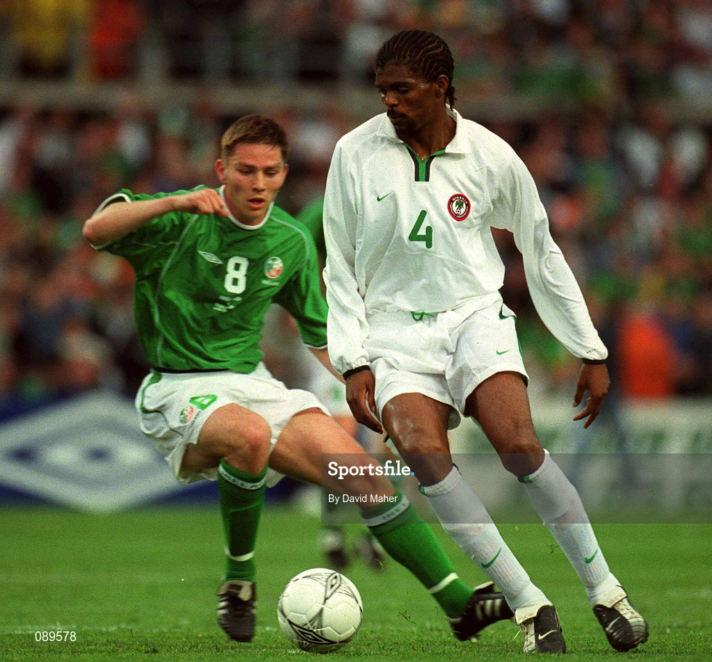 16 May 2002; Nwankwo Kanu of Nigeria in action against the Republic of Ireland's Matt Holland during the International Friendly match between Republic of Ireland and Nigeria at Lansdowne Road in Dublin. Photo by David Maher/Sportsfile