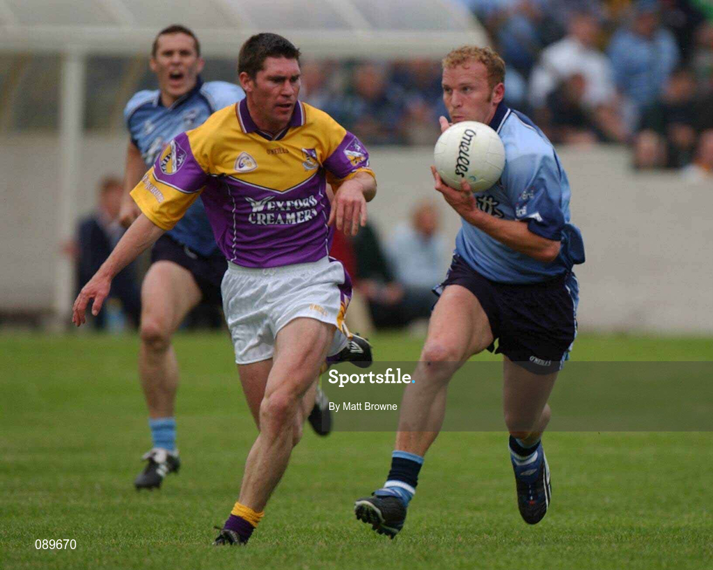 1 June 2002; Shane Ryan of Dublin in action against Wexford's Darragh Breen during the Bank of Ireland Leinster Senior Football Championship Quarter-Final match between Wexford and Dublin at Dr. Cullen Park in Carlow. Photo by Matt Browne/Sportsfile